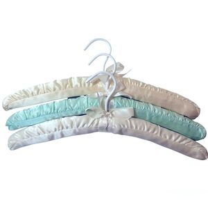 Three Luxurious Padded Satin Hangers-2 Cream and 1 Soft Blue Hanger.